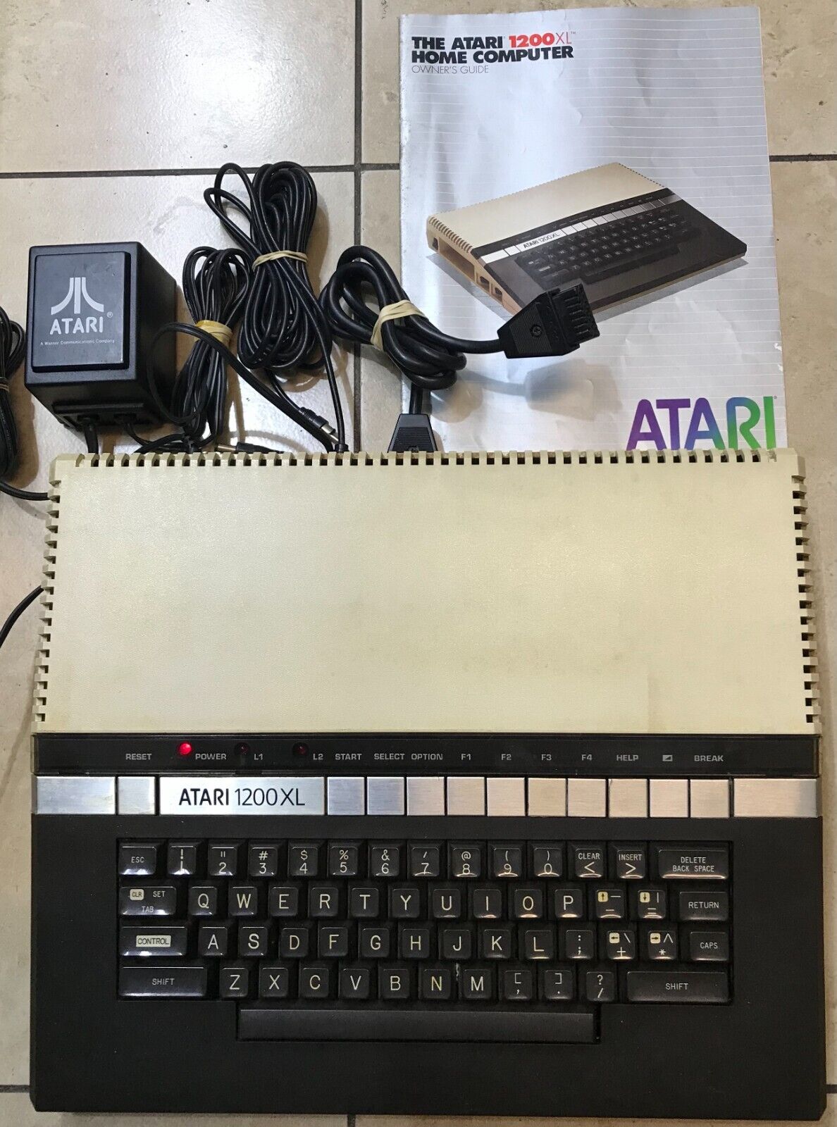 Vintage Family owned Atari 1200xl computer sold as is tested turns on with cable