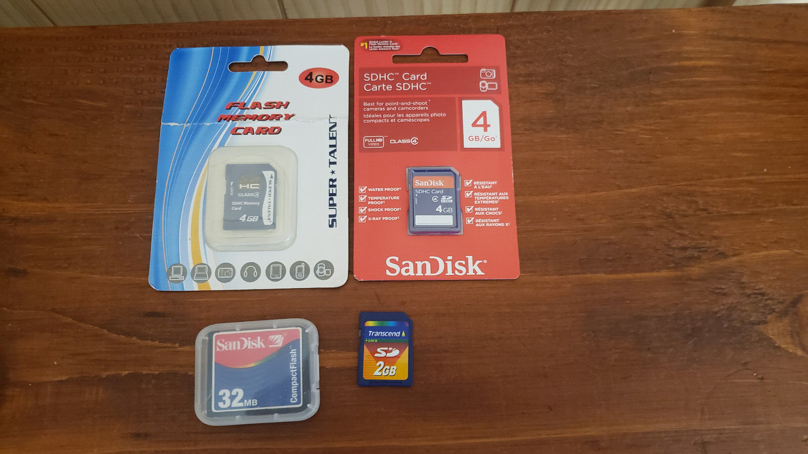 4 Assorted Memory Cards - 2 Factory Sealed (4GB) 2 Used (32MB & 2GB) Untested