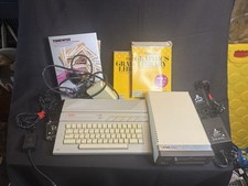 Atari 130 XE/Atari 1050 Bundle W/ Cords And Extras (Powered On) picture